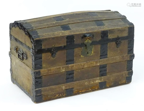 An early 20thC casket with wrought iron strapping …