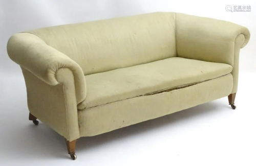 A late 19thC Chesterfield sofa raised on s…