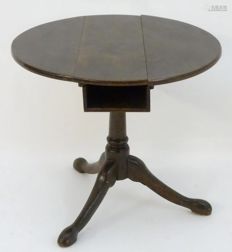 A late 18thC oak tripod table with a birdcage movem…