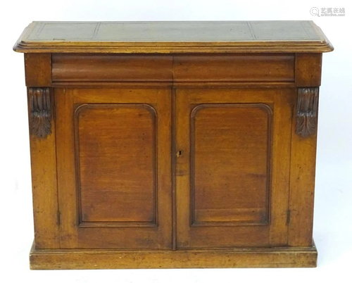 A late 19thC mahogany chiffonier with an inset leather