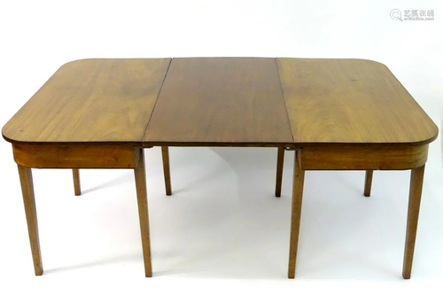 A 19thC mahogany D-ended dining table raised on