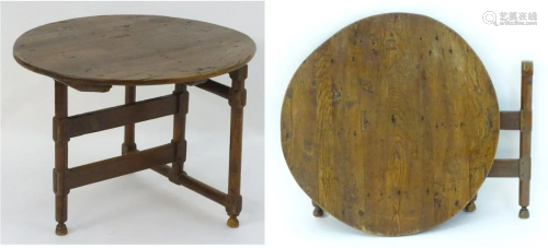 An 18thc elm folding coaching table of peg jointed