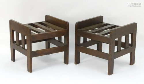 A pair of early 20thC oak luggage racks, bearing …