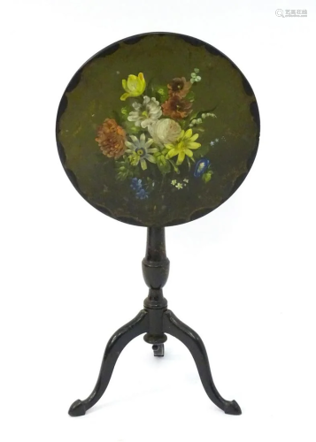 An early 20thC slate top table with a still life floral