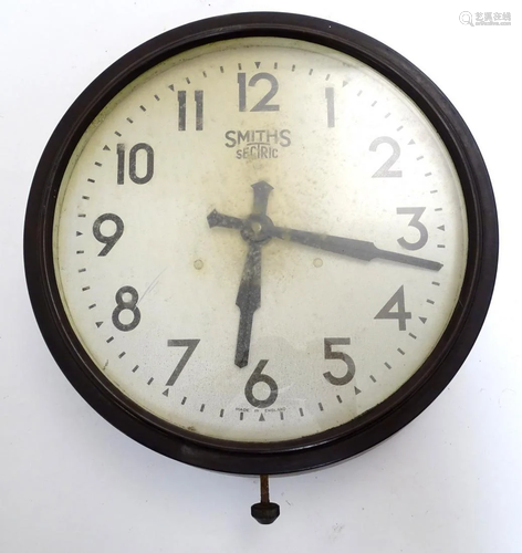 A mid 20thC Bakelite wall clock made by Smiths. The