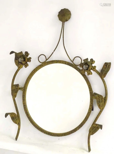 A circular mirror / girandole adorned with floral