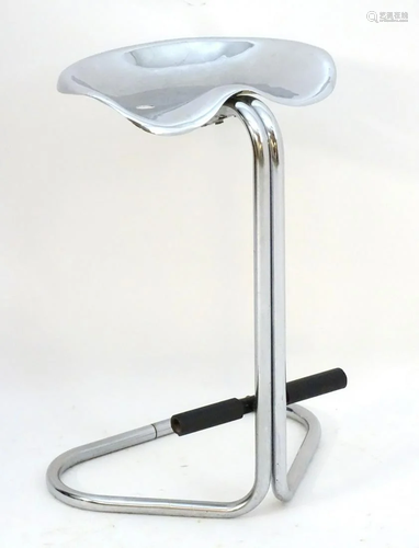 A mid century modern designer tall stool of tubular