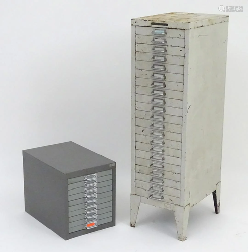 Two vintage industrial steel filing cabinets, the