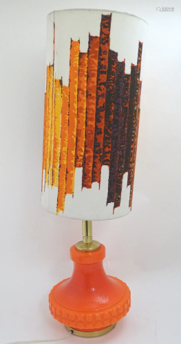 A vintage retro table lamp, with neon orange gla…