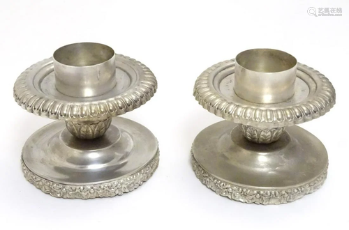 A pair of large candle holders, nickel plated with