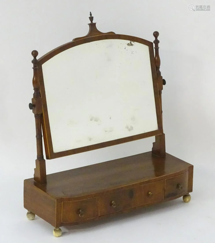 An early 19thC mahogany toilet mirror / dres…