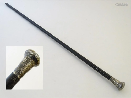 A Victorian ebony cane, with hallmarked silver knop.