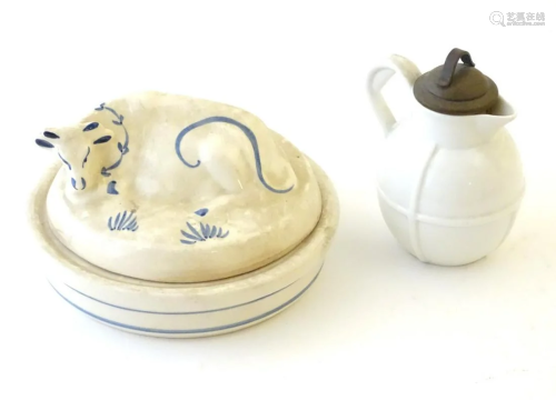 A Welsh pottery lidded butter dish with recumbent cow