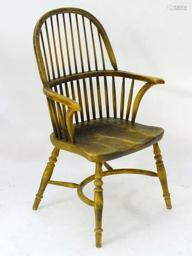 A 20thC double bow beech Windsor chair with a …