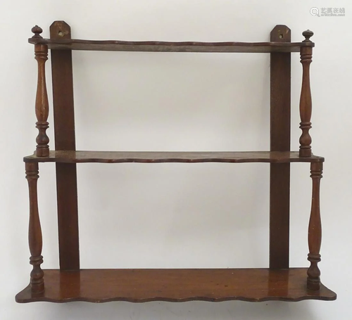 An early 20thC set of mahogany wall shelves with …