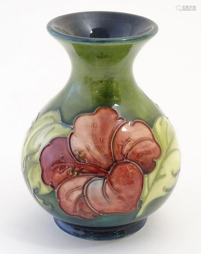 A Moorcroft vase with tube lined hibiscus flower