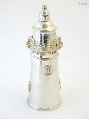A 21stC novelty cocktail shaker formed as a lighthouse.