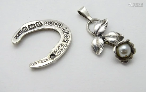 A silver pendant / fob formed as a 'Good Luck'