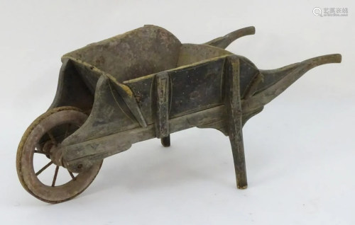 A late 19thC small wheelbarrow, of pine constru…