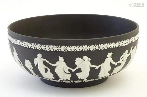 A black Wedgwood Jasperware bowl decorated w…