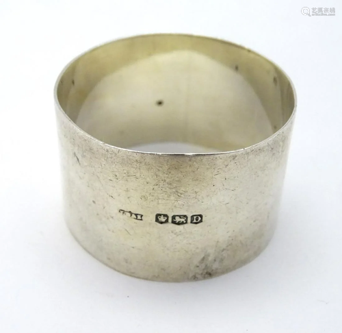 A silver napkin ring, hallmarked Sheffield 1946, m…