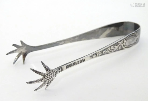 Silver sugar tongs with birds claw formed grips