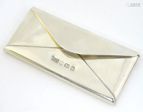 A novelty silver stamp case formed as an envelope