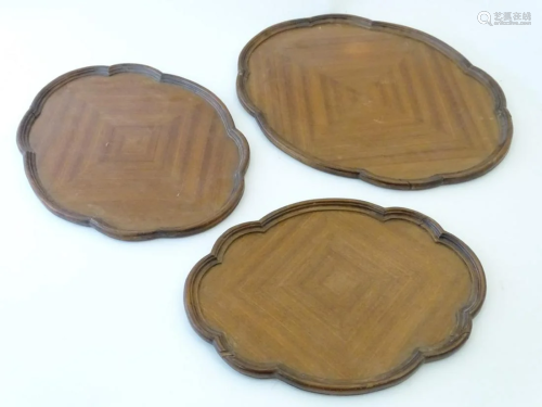 A graduated set of three Art Deco trays with lobed
