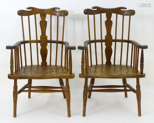 A pair of 19thC comb back Windsor chairs with sw…