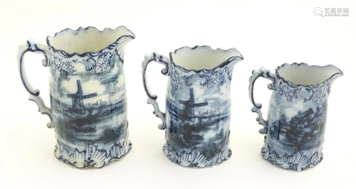 Three Victorian blue and white graduated jugs with