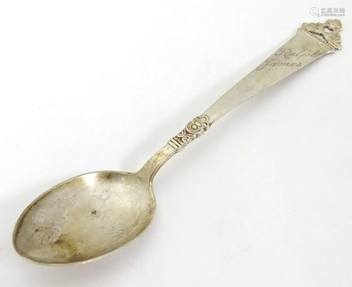 A Continental .830 silver teaspoon with scroll