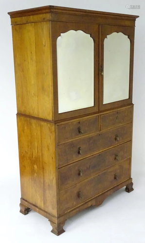 An early 20thC Maple & Co linen press with a moulded