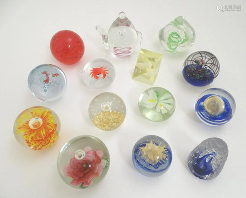 Thirteen assorted art glass paperweights, including…