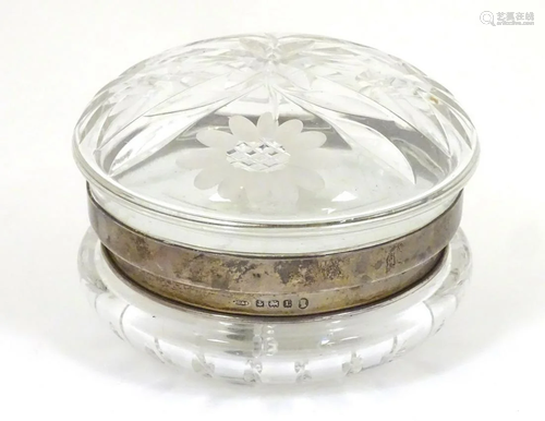 A cut glass dressing table powder bowl with silver…