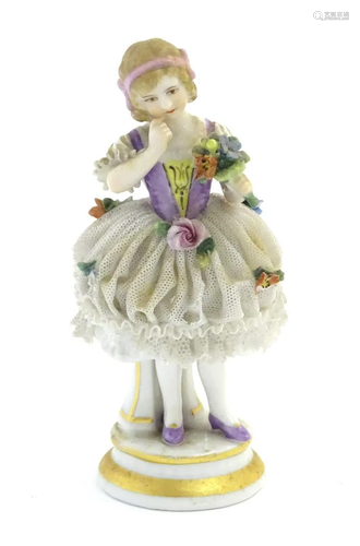 A German porcelain figure of a flower girl with a