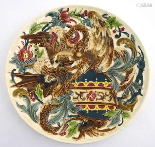 A large 19thC Austrian charger decorated in relief …