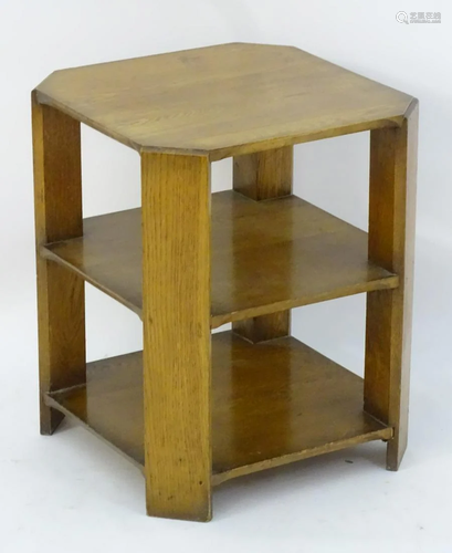 An Art Deco oak three tier table with four chamfered