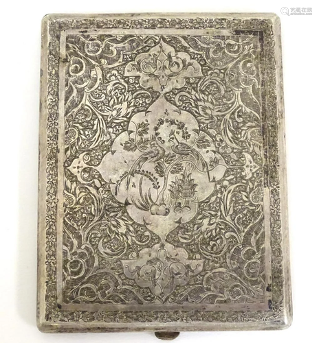 A white metal cigarette case with engraved decoration