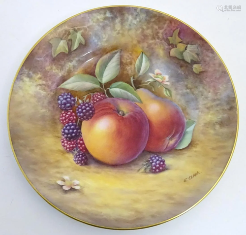 A Royal Worcester plate with hand painted decoration