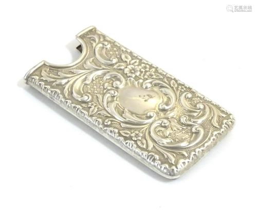 A silver card case with embossed decoration hallmar…