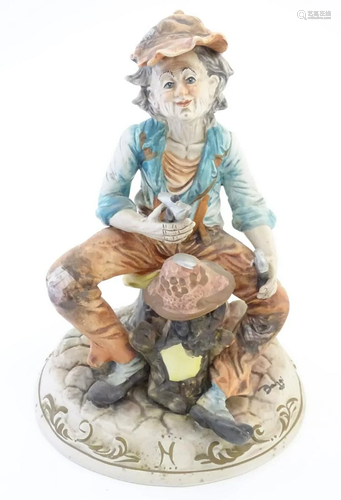 A Capodimonte figure of an elderly man with tools,