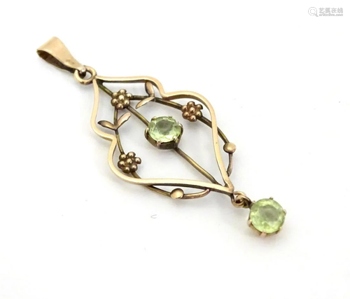 A 9ct gold Art Nouveau pendant set peridot drop. App…