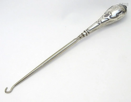 A silver handled button hook hallmarked Birmingham …