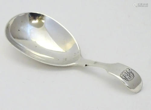 A Victorian silver fiddle pattern caddy spoon