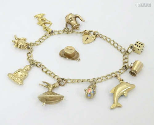 A 9ct gold charm bracelet set with various 9ct …