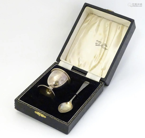 A silver egg cup and spoon hallmarked Birmingha…