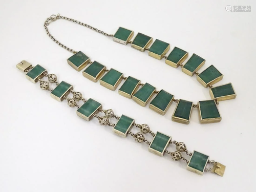 A white metal necklace and bracelet with malachite