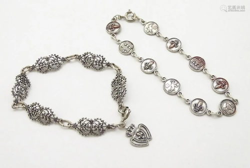 A white metal bracelet together with a silver plate