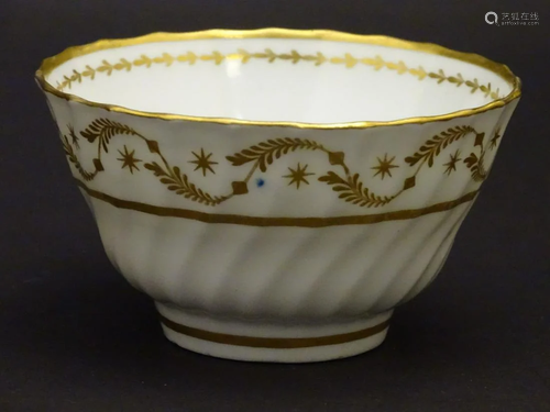 A 19thC white porcelain tea bowl with ribbed sides and