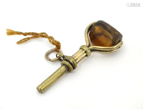 A Victorian gilt metal picket watch key having rota…